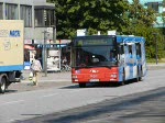 Wg.133 vom Typ MAN NL 313 der LVG mit Werbung fr die Lbecker Zeitung und Wg.319 vom typ MB O405GN2 des Stadtverkehr Lbeck mit Werbung fr Helm Reifen erreichen bzw. Verlassen den Zob Lbeck.